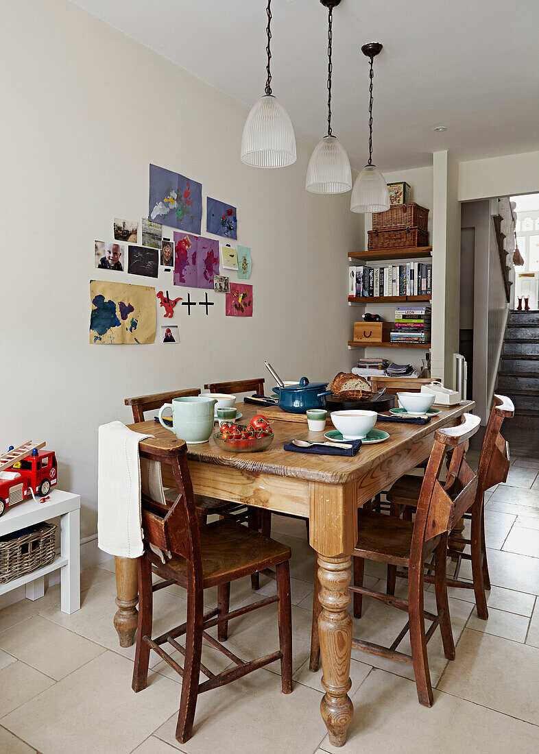 Wooden kitchen table in kitchen of contemporary London family home   England   UK