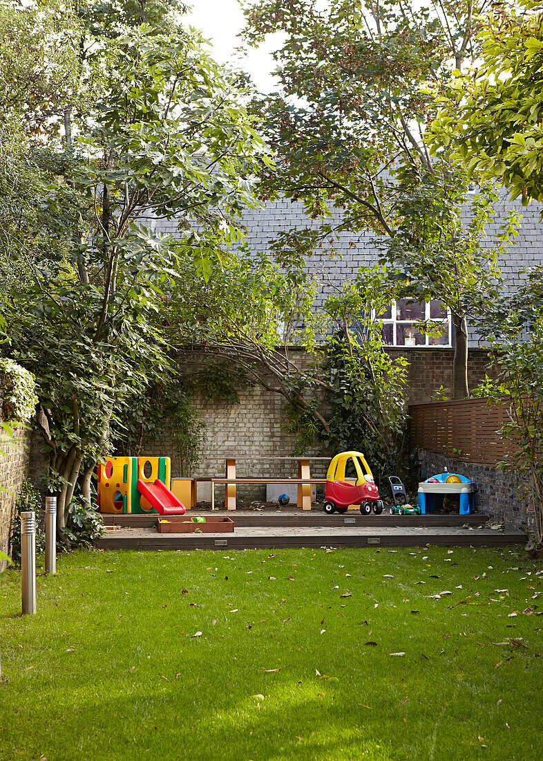 Play area n garden of family townhouse  London  England  UK