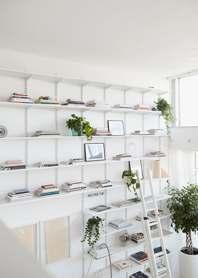 Double height open shelving in London home  UK
