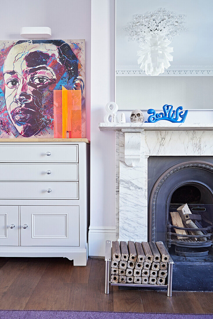 Pop art and marble fireplace in London townhouse  England  UK
