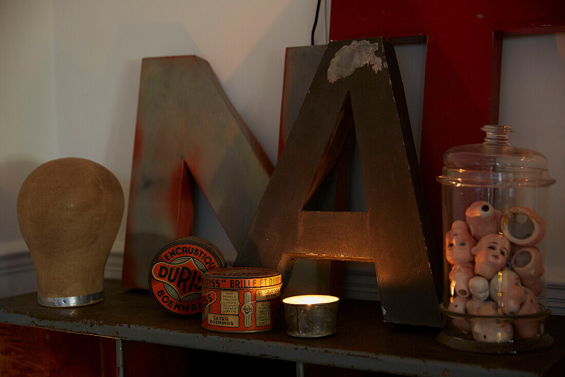 Letters 'A' and 'N' with vintage storage tins and dolls heads  Rochester  Kent  UK