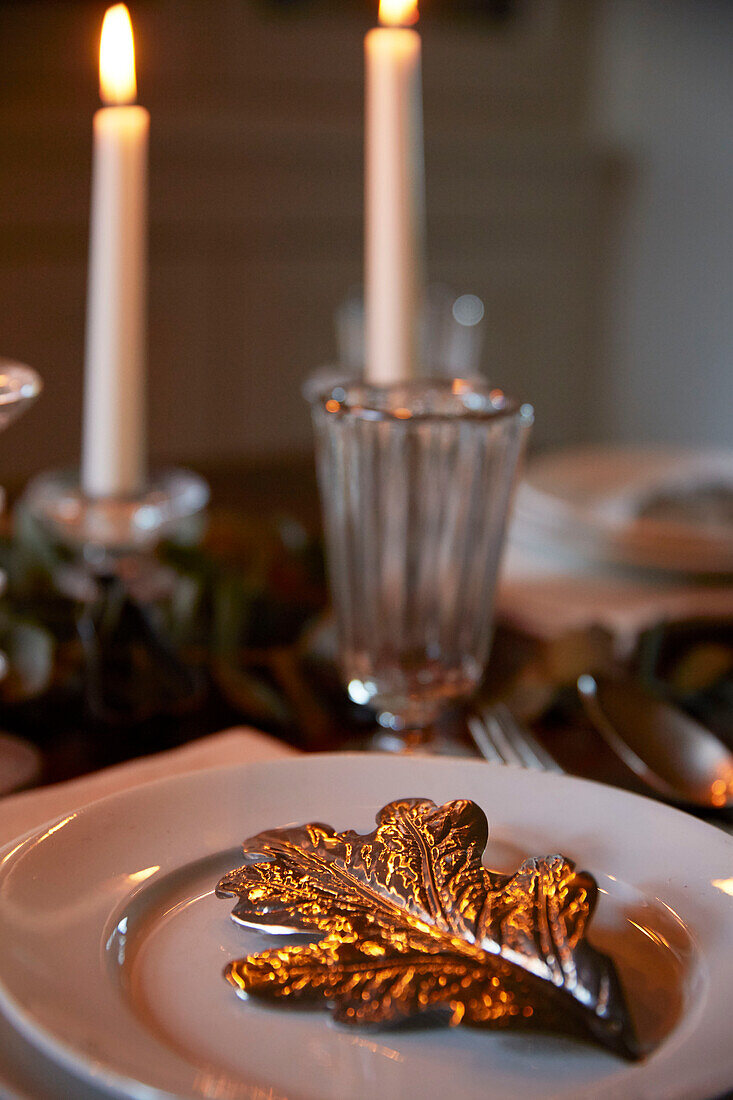Candlelit silver leaf on place setting  Rochester  Kent  UK