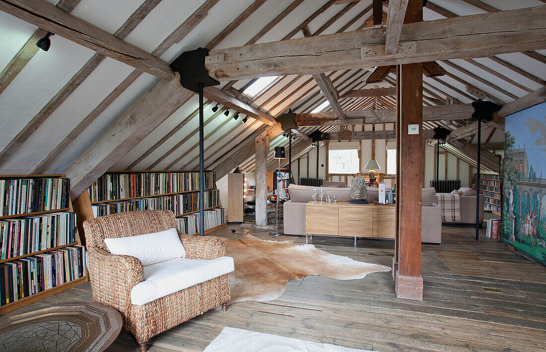 Seating ands shelving in open plan living space of watermill conversion