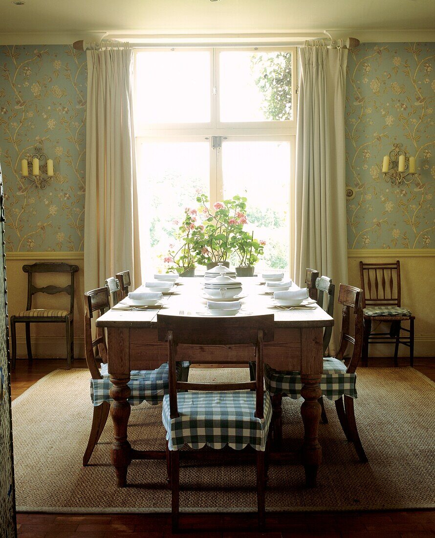Breakfast room in country classical style with large pine table 