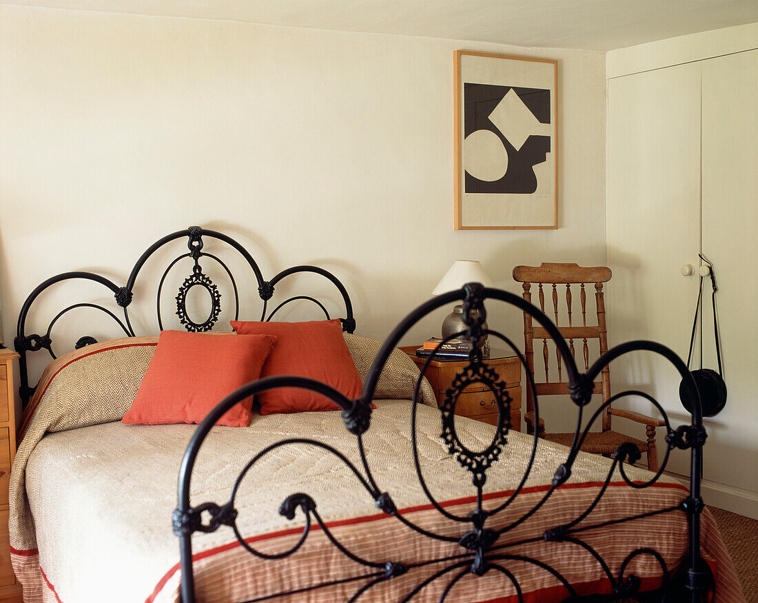 Bedroom with ornate wrought iron foot and headboard