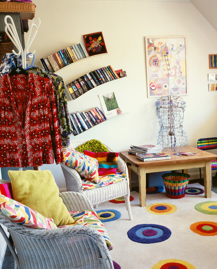 Can armchairs in room with patterned carpet and unusually angled shelving for books