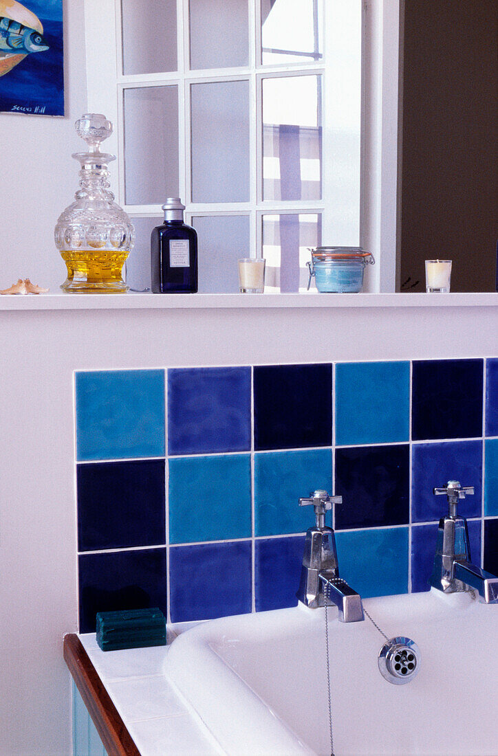 Purple and blue tiled splashback on bathroom sink