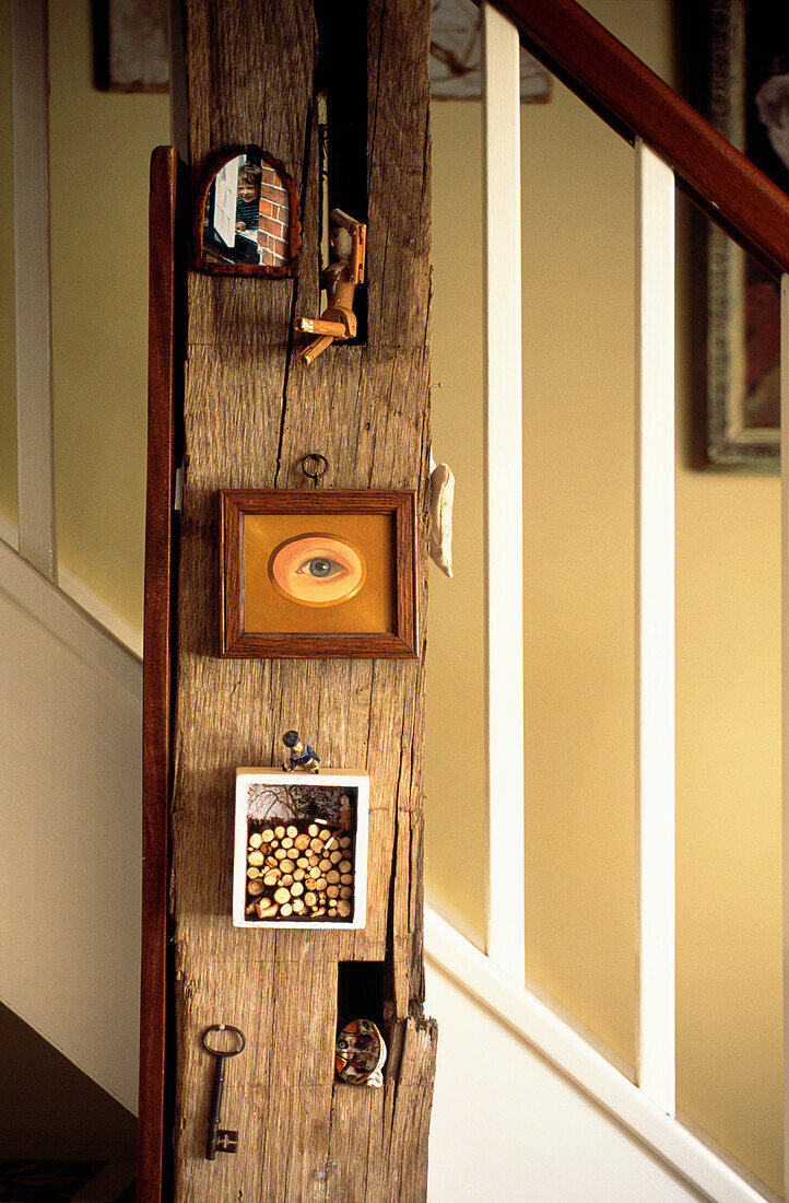 Timber supporting beam with artwork and staircase spindles