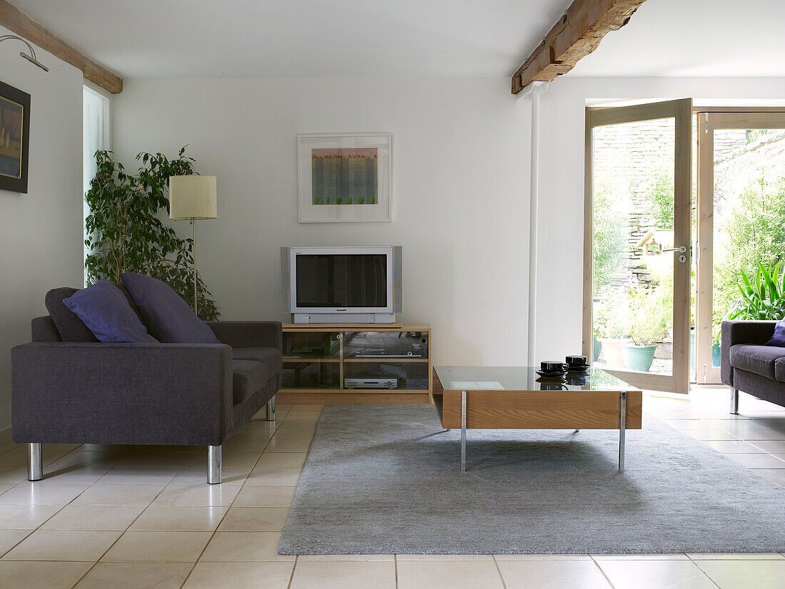 Modern living room with open patio doors