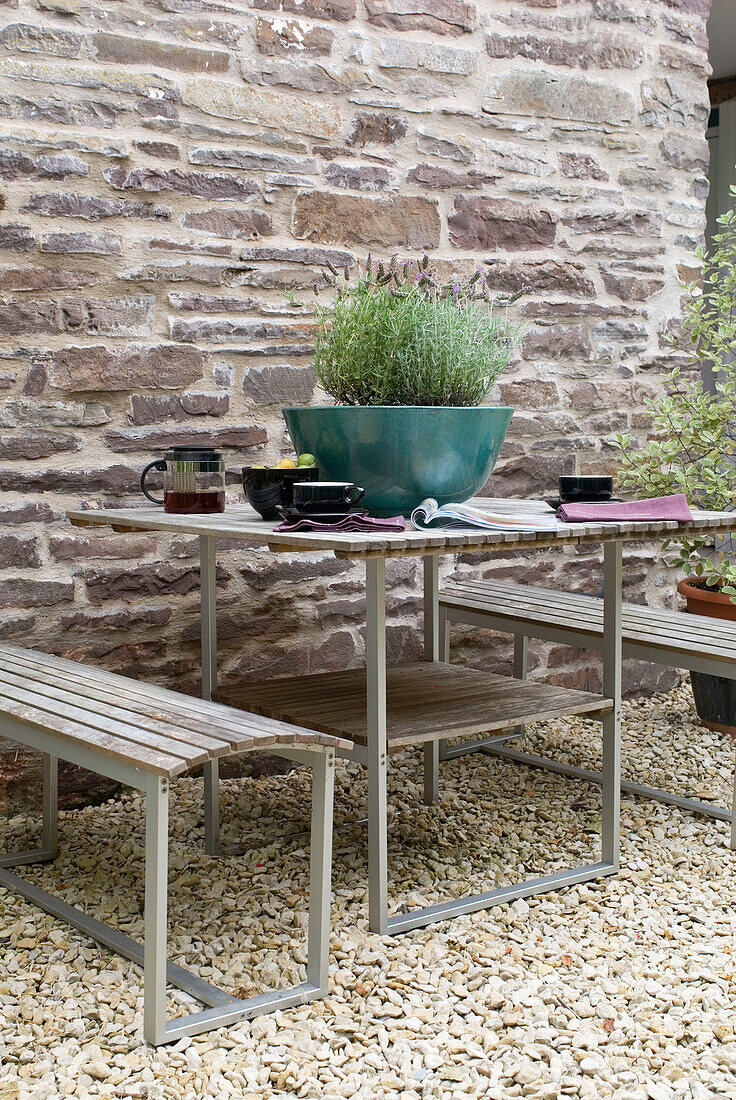 Table and benches with lavender on patio