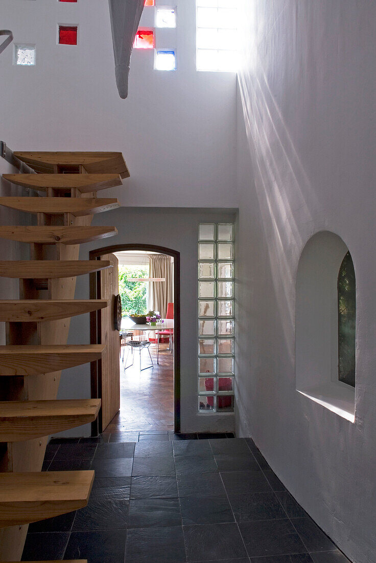 stairs in modern house with dining room in the background