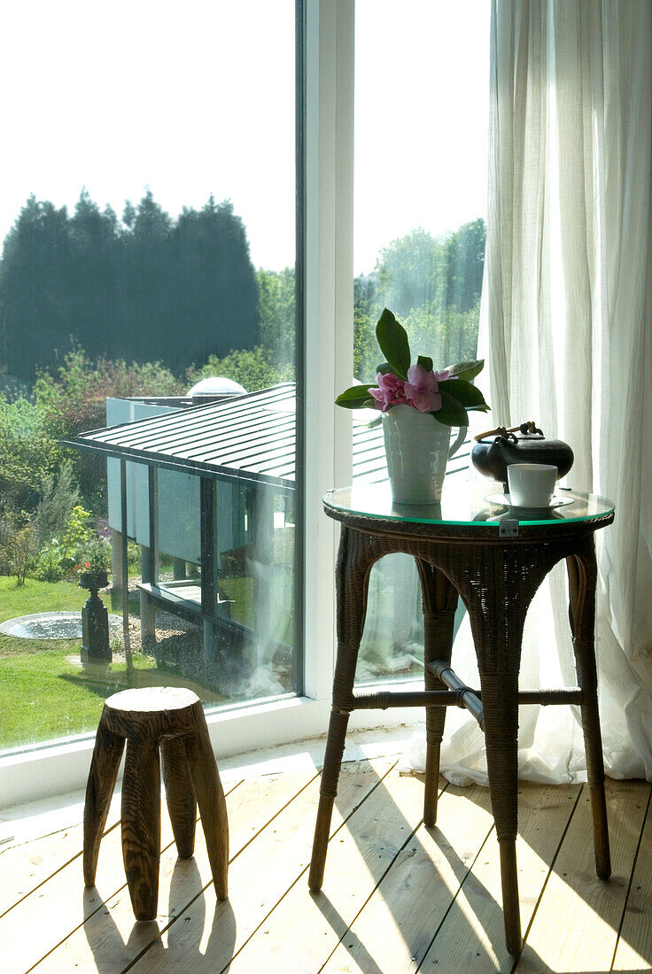 Coffee table and stool with view from window