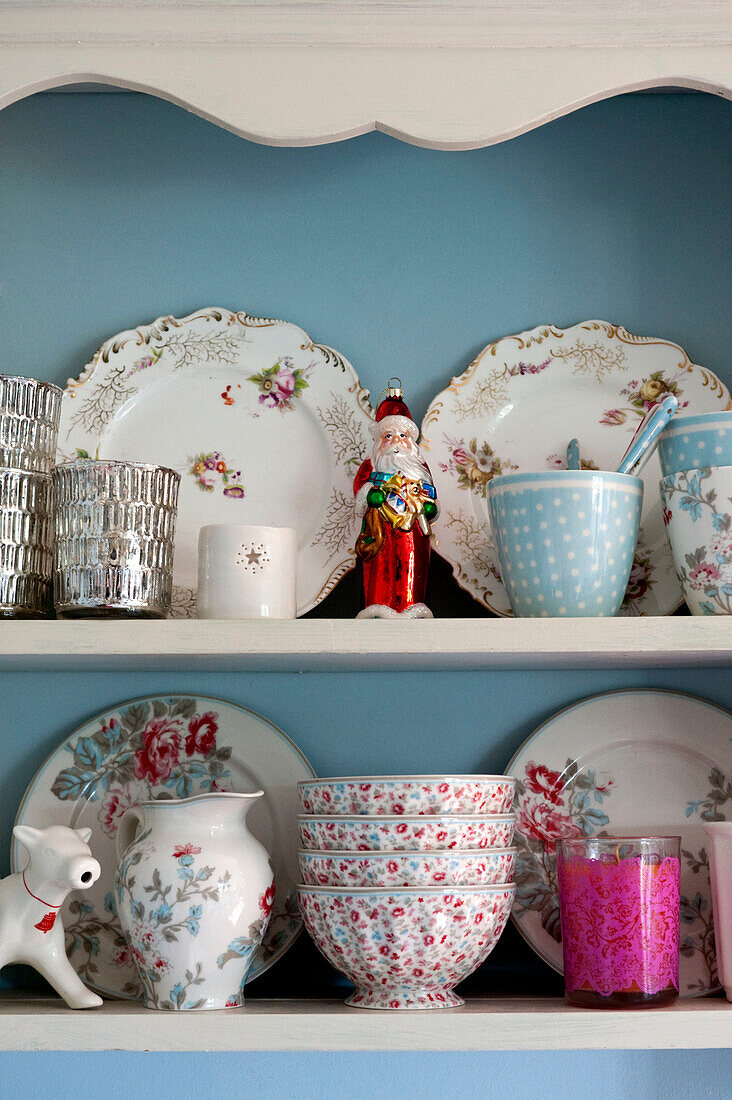 Plates and bowls on painted shelving