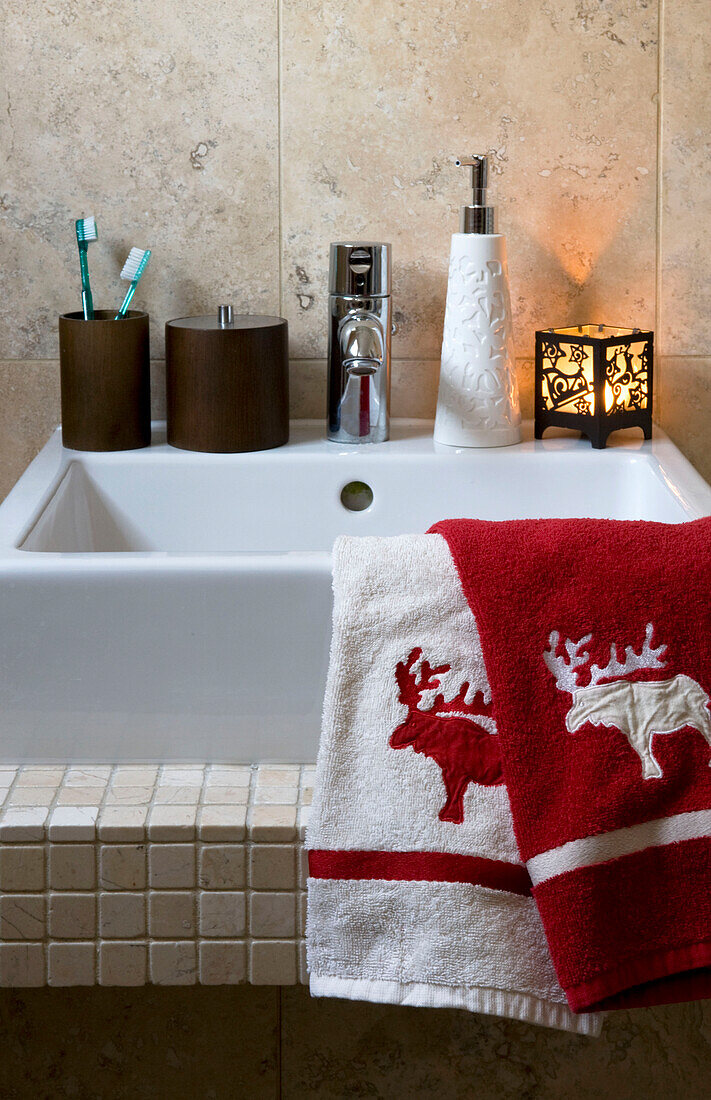 Bathroom sink with decorative Christmas towels