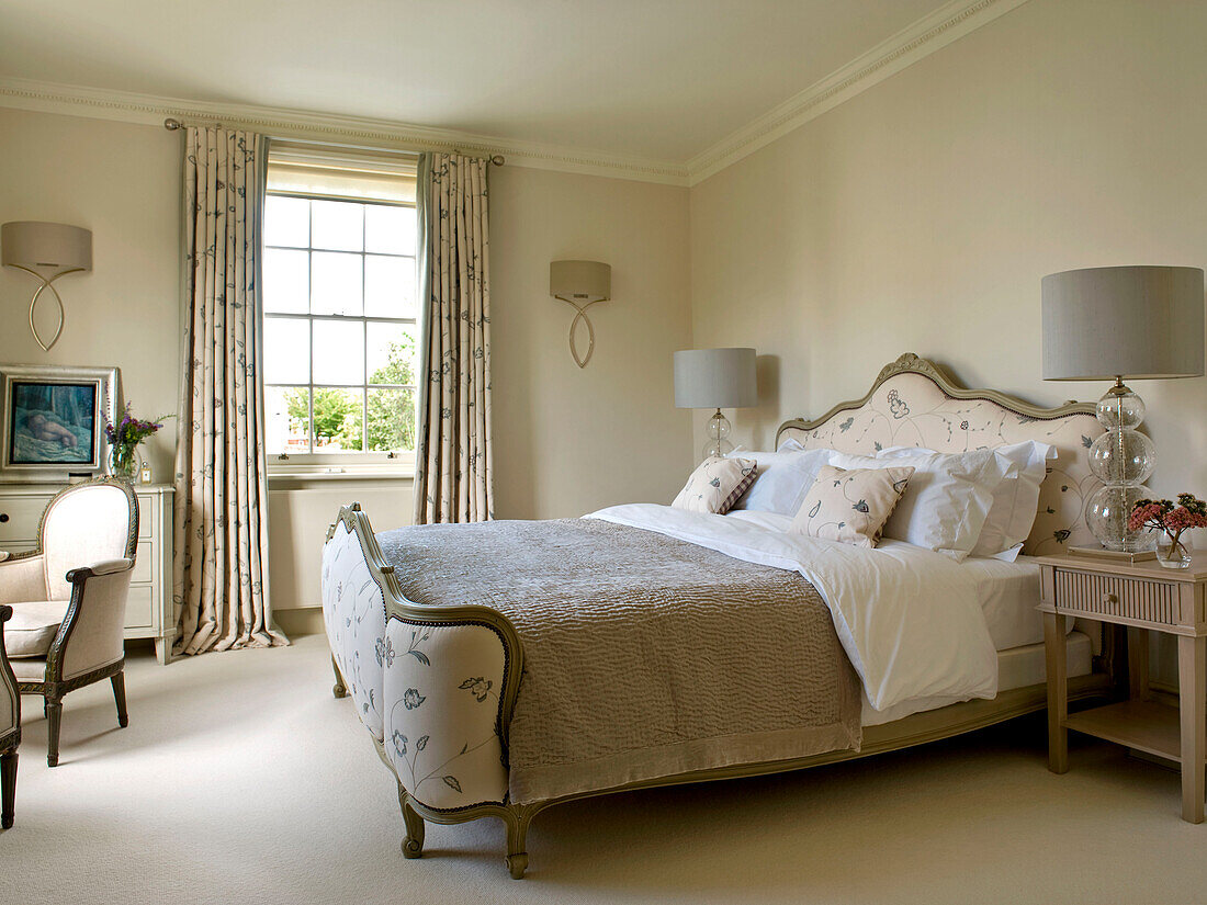 Co-ordinating fabrics in bedroom of West London townhouse England UK
