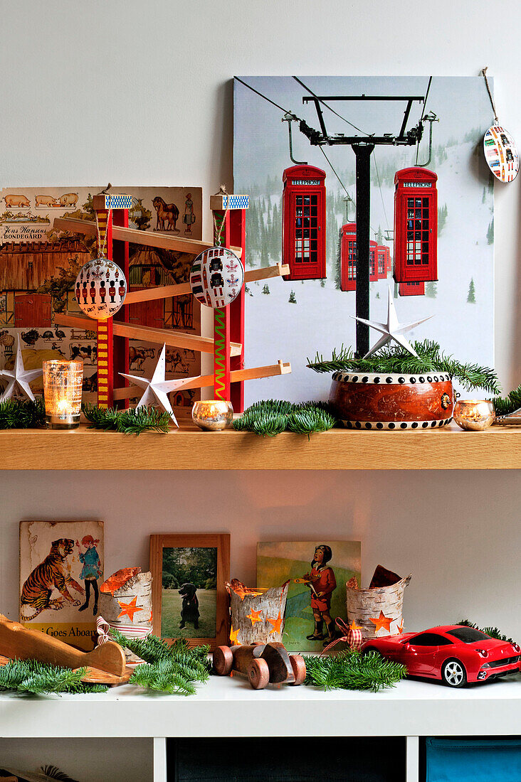 Artwork and ornaments with pine needles on shelves in Forest Row family home, Sussex, England, UK