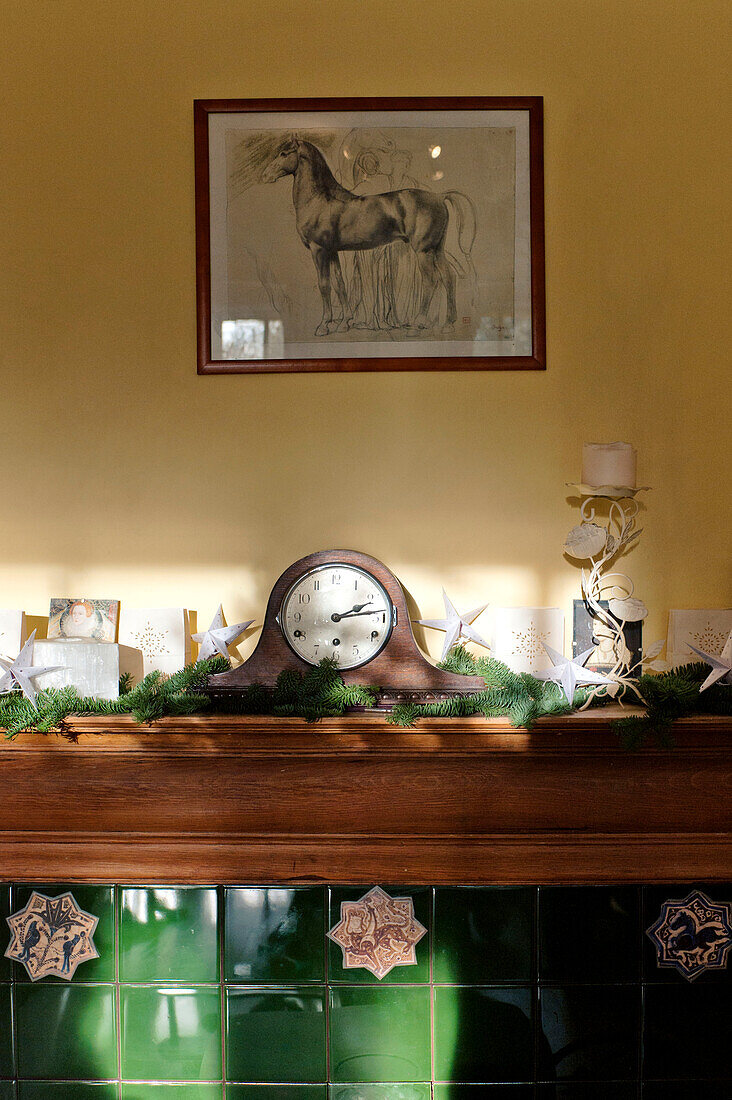 Sunlit fireplace Christmas detail in Forest Row family home, Sussex, England, UK
