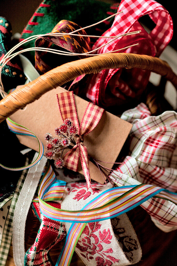 Assorted ribbons in a basket, Walberton home, West Sussex, England, UK