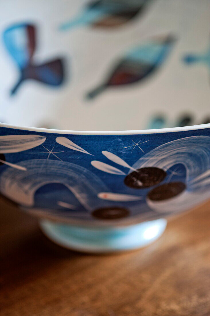Blue hand painted bowl in Bovey Tracey family home, Devon, England, UK
