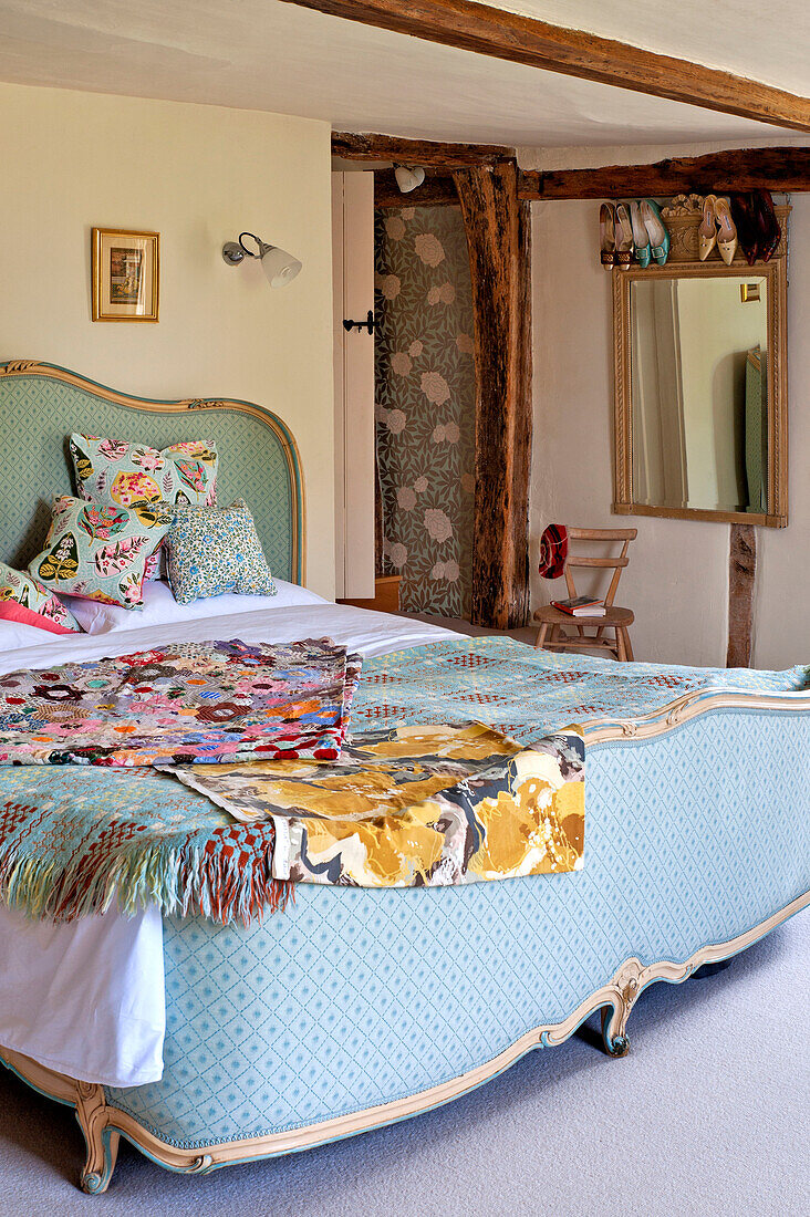 Fabric samples on vintage bed in Hertfordshire home, England, UK
