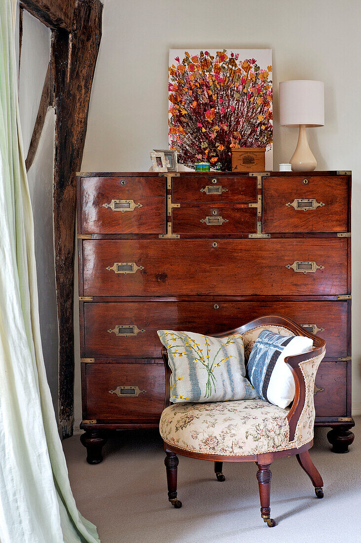 Antique wooden chair and storage unit in Hertfordshire home, England, UK