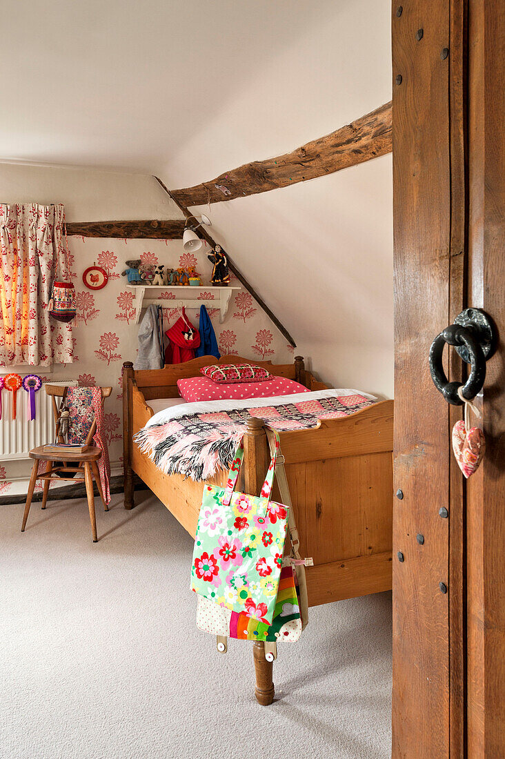 Wooden single bed in childs room, Hertfordshire home, England, UK