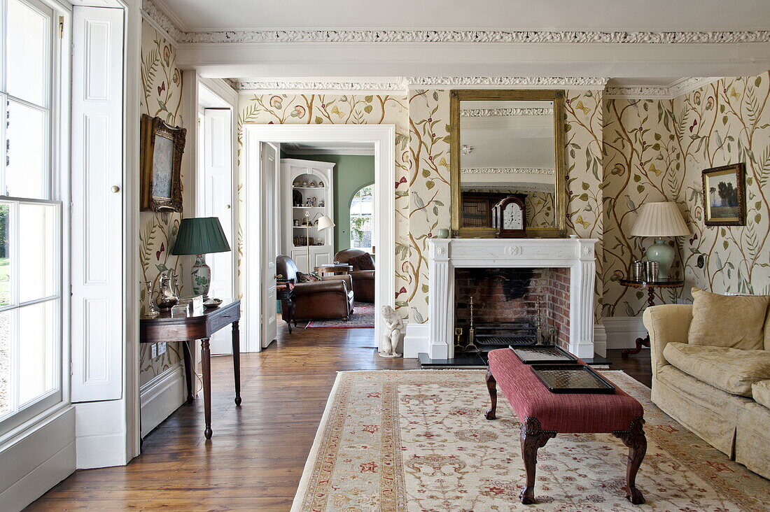 Patterned wallpaper in living room of contemporary Suffolk country house, England, UK