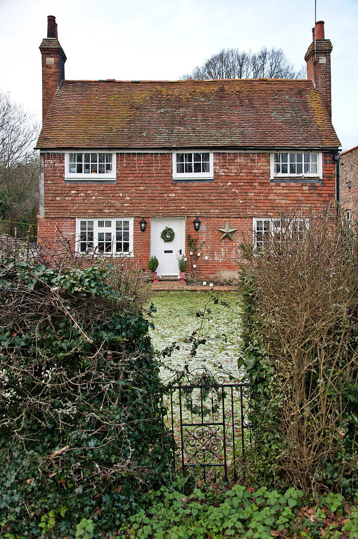 Brick exterior of detached Shropshire cottage, England, UK
