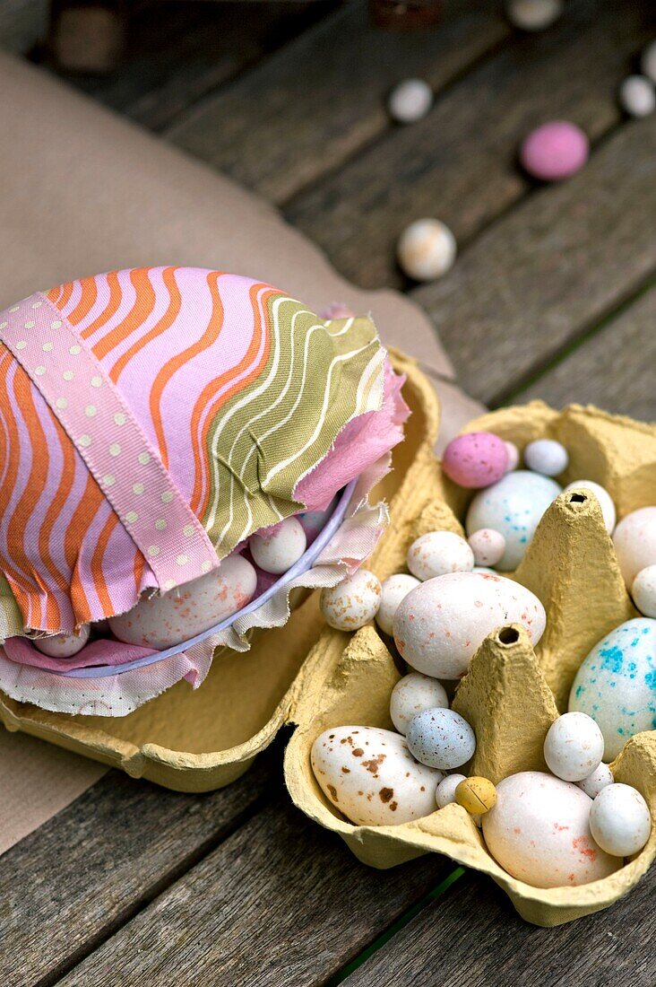 Handmade Easter eggs in egg box on garden table Sussex UK
