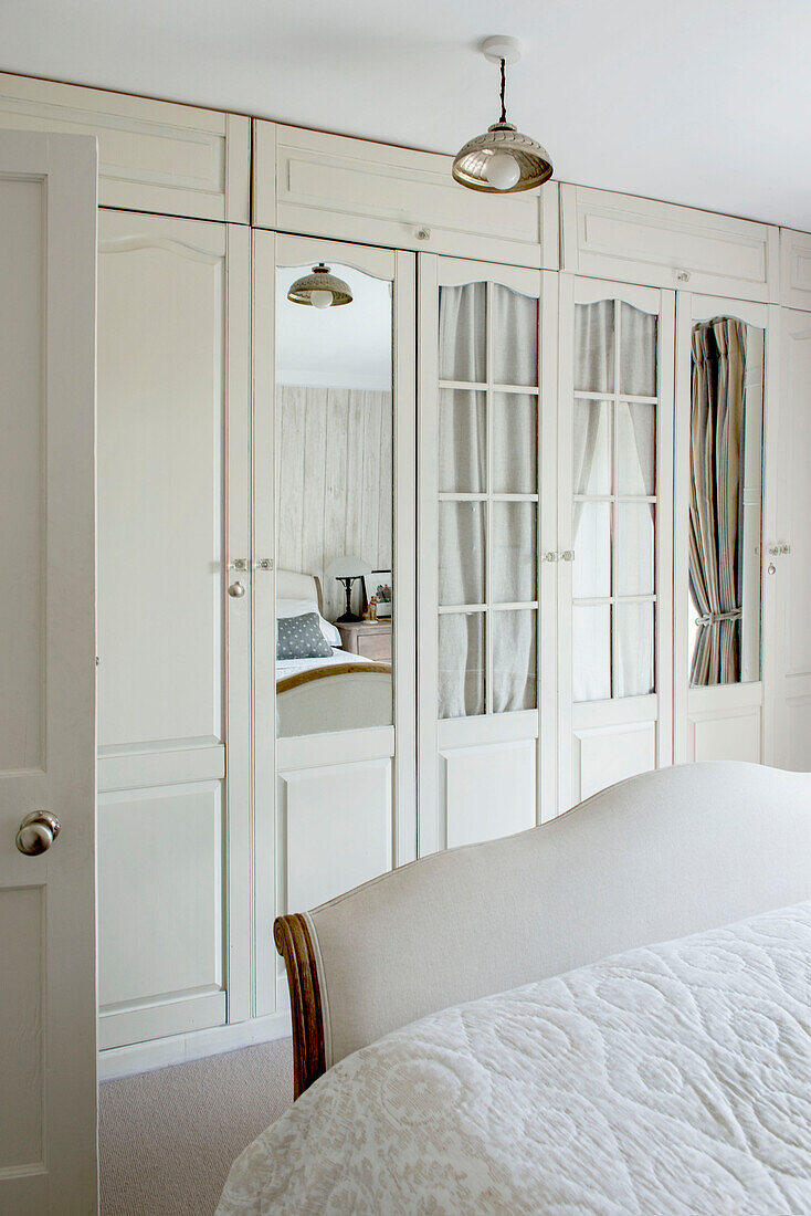 Mirrored wardrobe in bedroom of Penzance farmhouse Cornwall England UK