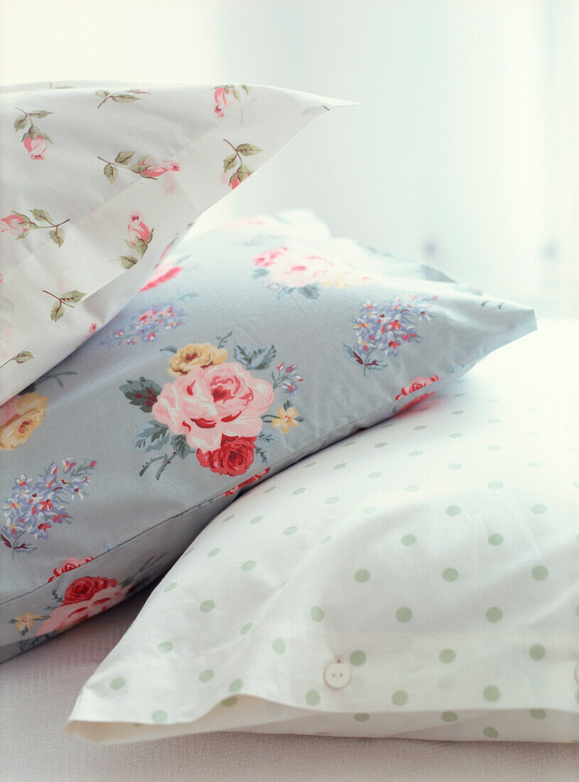 Detail of floral rose printed and polka dot pillowcases 