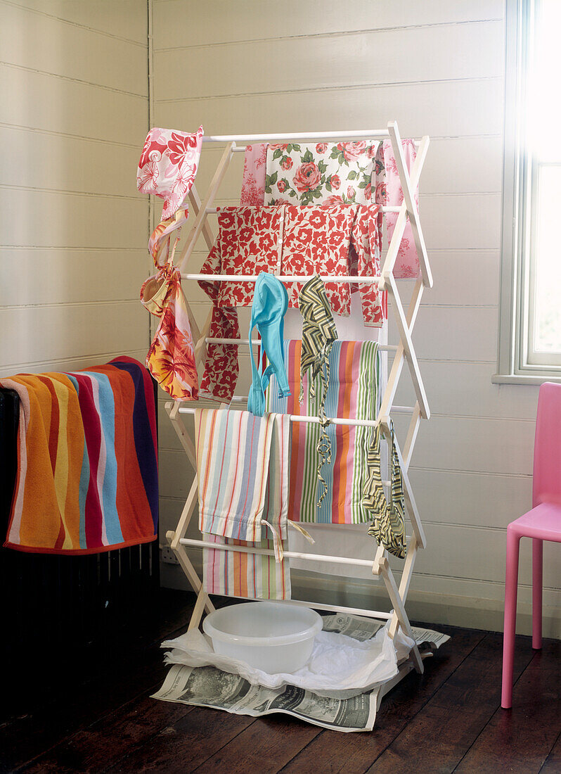 Wooden clotheshorse with printed fabrics