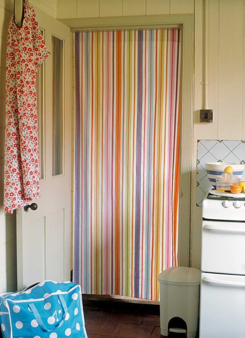Striped curtain in kitchen door
