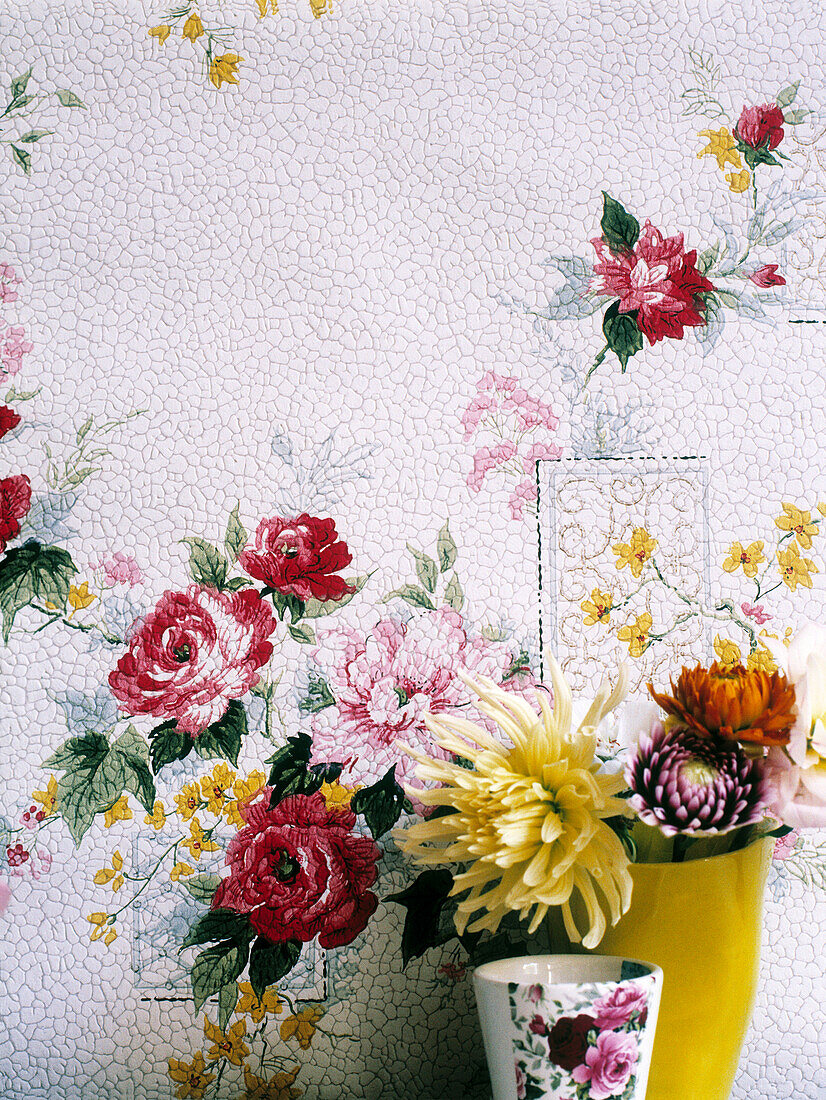 Cut flowers with vintage rose wallpaper