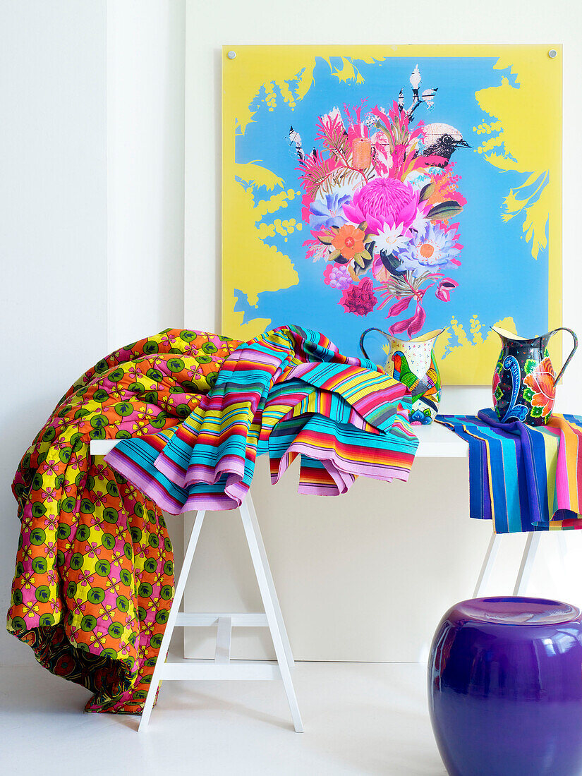 Assorted fabrics with modern art and purple stool