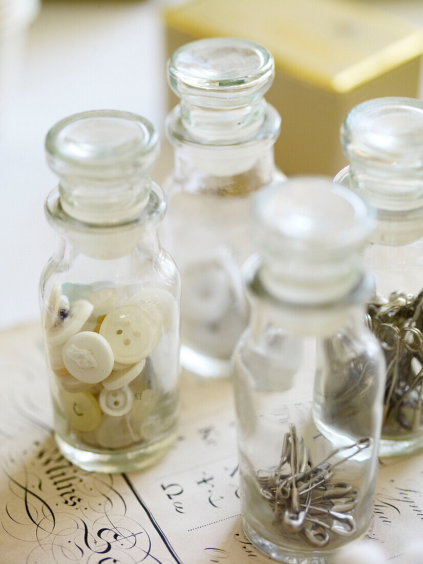 Antique vials with buttons and pins