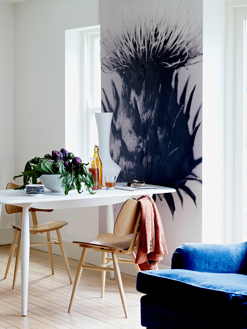 Large thistle artwork and table with chairs for two
