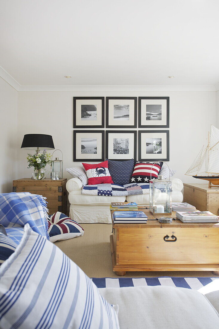 Black and white prints in nautical styled living room of Dartmouth home, Devon, UK