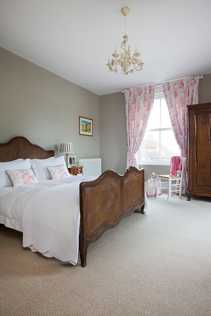 Cane double bed in bedroom of Kilndown home Cranbrook Kent England UK