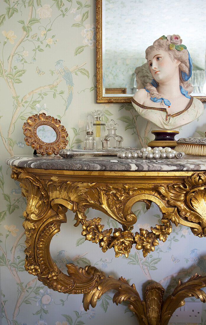 Female bust on gilt demi-lune dressing table in Kent home England UK