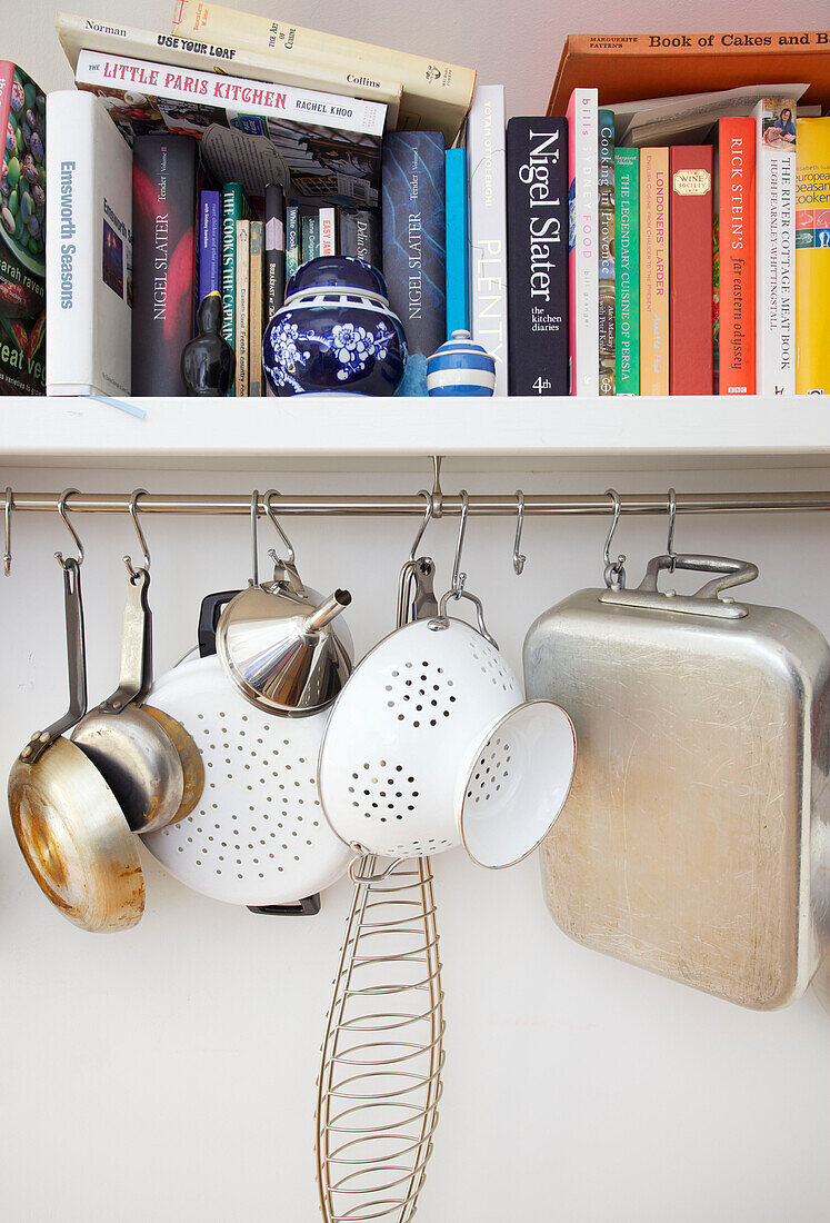 Bookshelf with kitchenware in Emsworth home Hampshire England UK