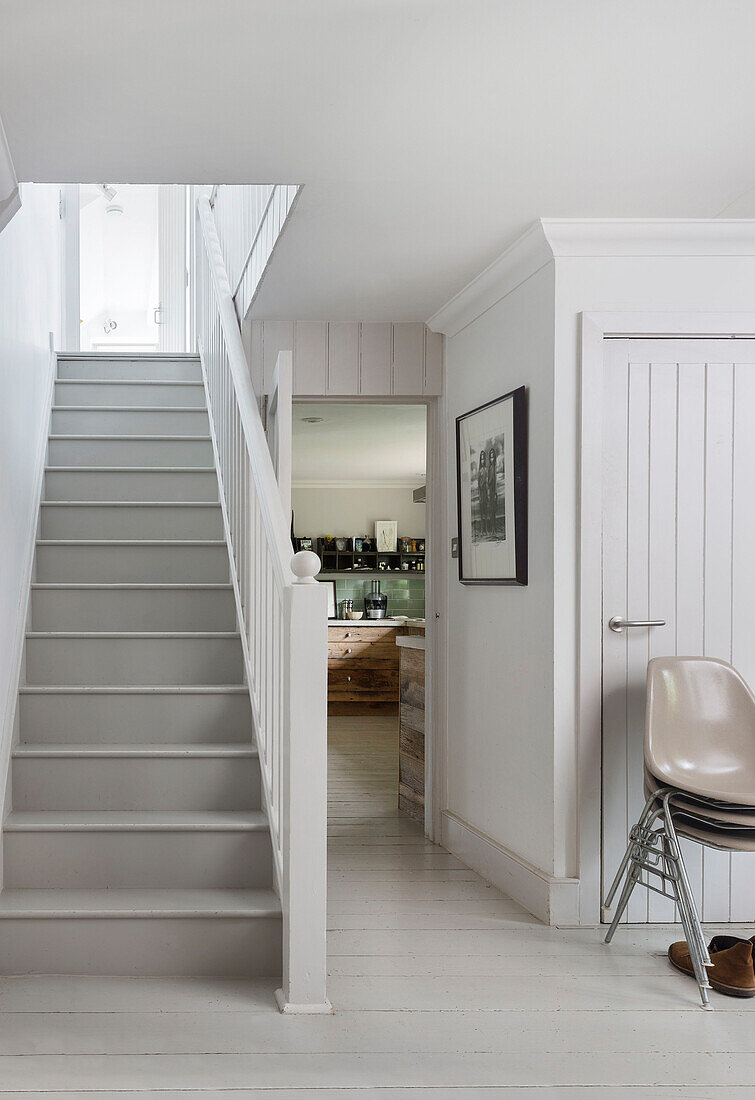 White entrance hall and staircase in Rye home East Sussex UK