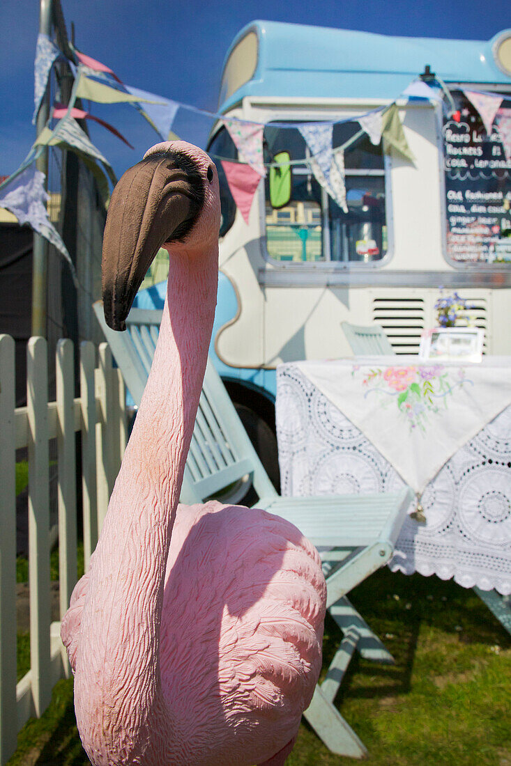 Pink flamingo and ice cream van Brighton Sussex England UK
