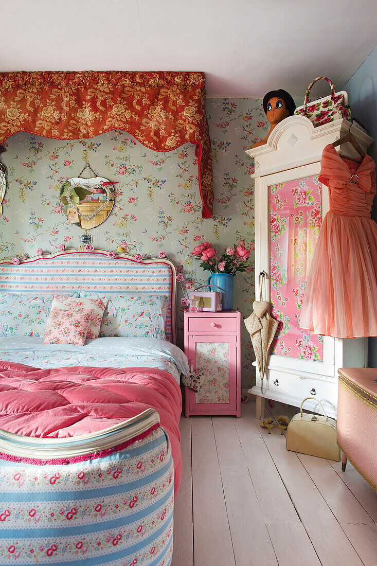 Contrasting florals with 1950s style dress on upcycled wardrobe in Tenterden bedroom Kent UK