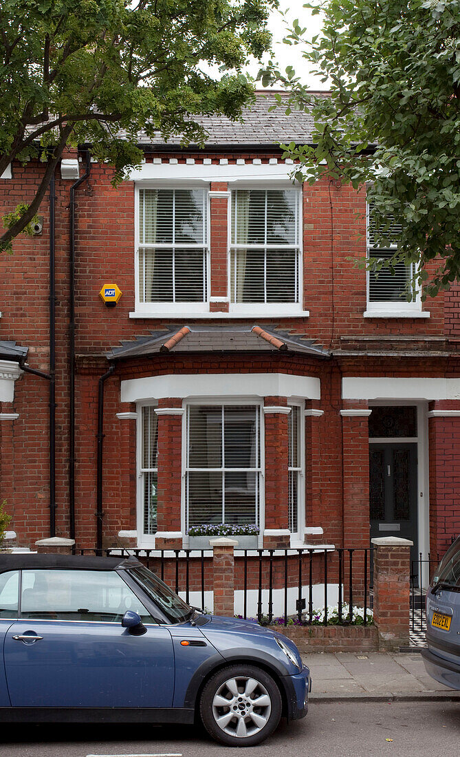 brick exterior of terraced London home, UK