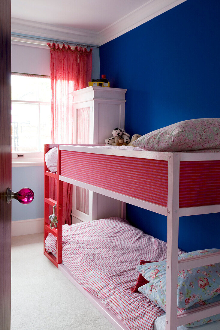 Bunk beds in blue painted bedroom