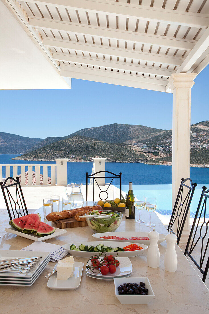 Dining table on terrace of luxury holiday villa, Republic of Turkey