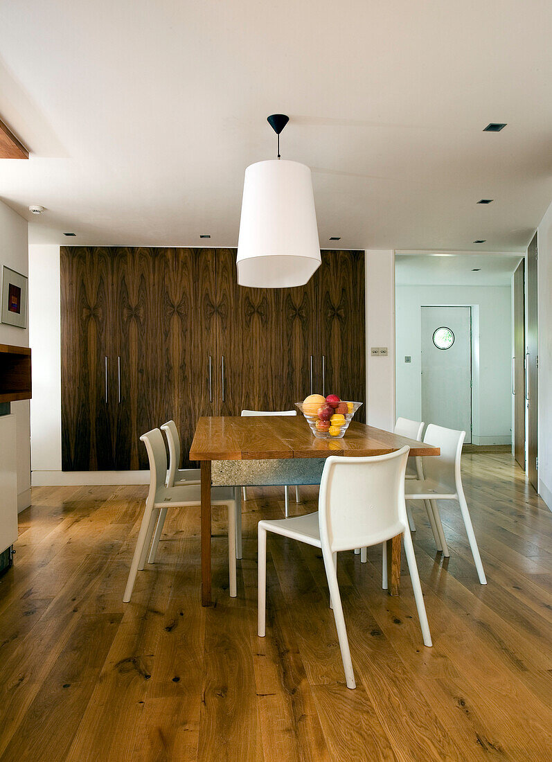 Table for six in open plan dining area of London home, England, UK
