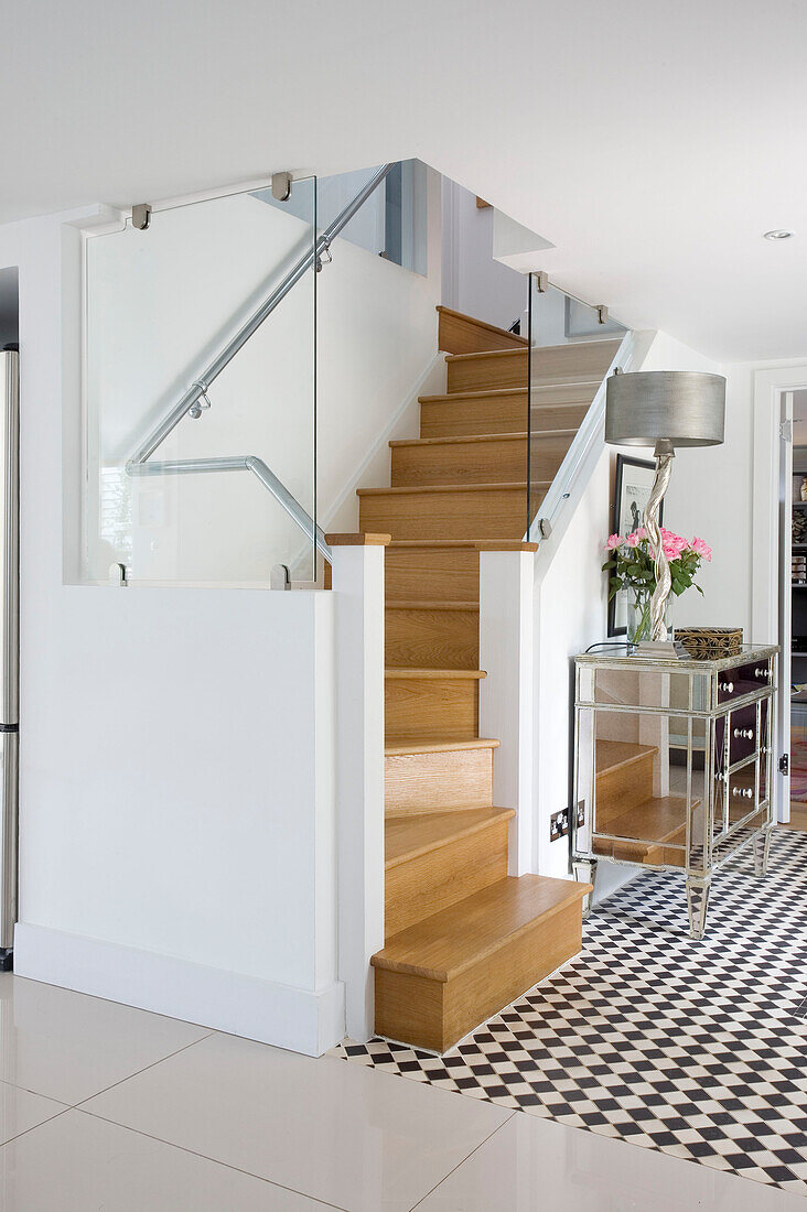 Glass partition to wooden staircase in Wepham home Sussex UK