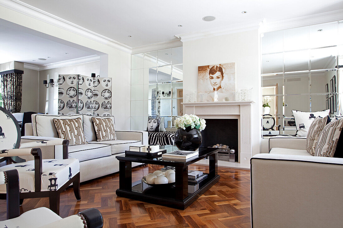 Black and white living room with parquet floor in Hendon home London UK